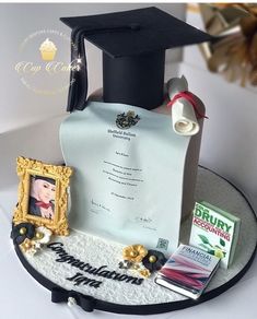 the cake is decorated with an image of a graduation cap and diploma on top of it