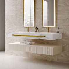 a bathroom with two sinks and mirrors on the wall