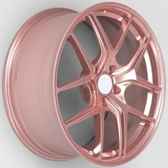 a close up of a pink wheel on a white background with no image to describe