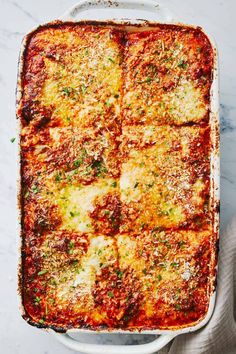 lasagna casserole in a white baking dish