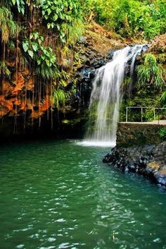 there is a waterfall in the middle of some water