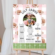 a wooden easer with a baby's birth announcement on it and an image of a football field