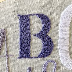 the letters b and c are knitted together with yarns in front of them