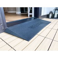 a door mat on the outside of a house