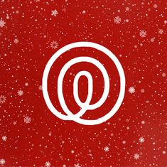 a red background with snowflakes and the letter q in white on top of it