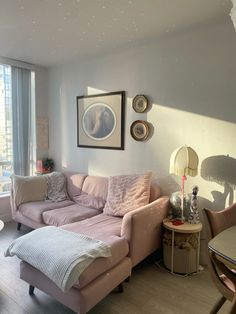 a living room filled with furniture next to a window covered in curtains and windowsills