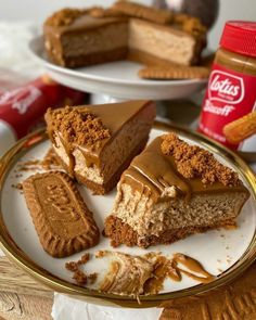 several pieces of cake on a plate with peanut butter and graham crackers next to it