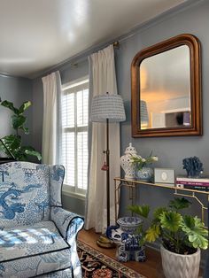 a living room with blue and white furniture