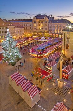 an aerial view of a christmas market in the city