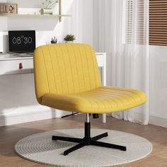 a yellow office chair sitting on top of a white rug in front of a desk