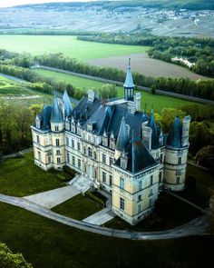 an aerial view of a castle in the countryside