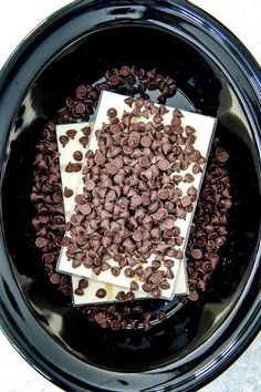 chocolate chips and cream in a black bowl