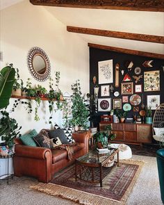 a living room filled with furniture and lots of plants