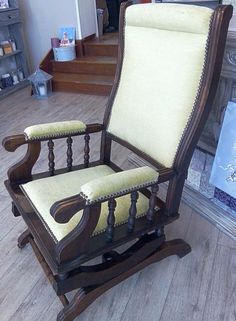 an old rocking chair is sitting on the floor