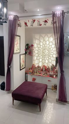 a living room filled with lots of furniture and decor on top of white tile flooring