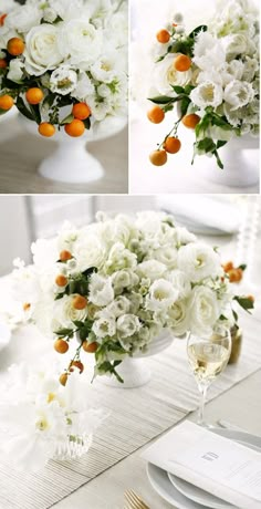 white flowers and oranges are arranged in vases