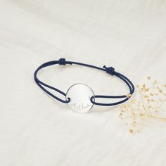 Looking for a special, sentimental gift for a man in your life? Our Men's Personalized Large Pastille Bracelet is available in a range of colors to suit every personality as well as your own unique hand-engraving.  925 Sterling SilverCharm: 0.8”x0.8”Braid made of durable, colorfast polyesterSize: between 8-9, fully adjustable sliding knot fasteningEngraved by hand in our Paris workshopSent with love in a complimentary gift boxAny slight variations in lettering depth, spacing and alignment from t Engraved Bracelet, Sliding Knot, Sentimental Gifts, Hand Engraving, Sterling Silver Charm, Silver Charms, Gift Bag, Thing 1, 925 Sterling Silver