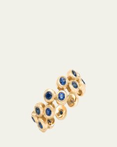 Audrey C. Jewels band ring    14karat yellow gold    Set with 21 round blue sapphires    0.84 total sapphire carat weight    Made in USA Floating Ring, Travel Size Perfume, Yellow Gold Setting, Ring Watch, Makeup Shop, Cleanser And Toner, Gold Set, Handbags On Sale, Ring Necklace