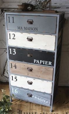 an old dresser with drawers and numbers on it