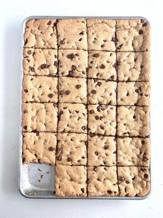 a pan filled with cookies on top of a white table