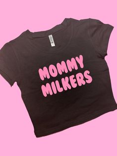 Mommy Milkers SNUG FIT Crop Top | Cute Crop Top | Graphic Top | Gift For Her | Y2K Baby Tee | Y2K crop top | Gift for friend Comfy Top to Lounge in! Actual item may be lighter/darker than pictured. M A T E R I A L S - SNUG FIT - 100% RING SPUN COTTON - Shoulder Taping S I Z I N G - Size chart is available on our listing photos. S H I P P I N G  &  P R O D U C T I O N  T I M E - Production Time is 5 Business Days. (May be delayed during the Holiday Season) - Shipping Time is 2-6 Business Days. (M Fitted Black Crop Top With Logo Print, Cute Fitted Cropped T-shirt For Streetwear, Fitted Logo Print Crop Top For Summer, Cute Pink Crop Top With Letter Print, Pink Y2k Crop Top With Letter Print, Y2k Pink Slogan Crop Top, Pink Y2k Slogan Crop Top, Y2k Slogan Pink Crop Top, Pink Slogan Y2k Crop Top