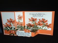 three cards with orange flowers on them, one is folded and the other two are closed