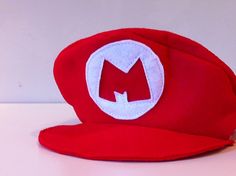 a red hat with the letter m on it