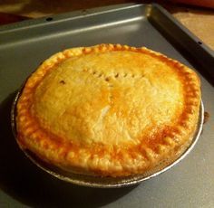 a pie sitting on top of a metal pan