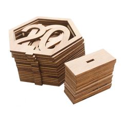 a stack of wooden coasters sitting next to each other on top of a white surface