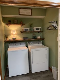 a washer and dryer are sitting in the laundry room next to each other