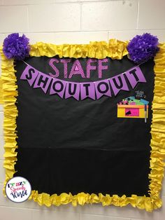 a black and yellow bulletin board with the words staff showout