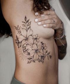 a woman's stomach with flowers on it