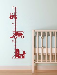 a child's growth chart wall decal with a tractor and barn on it