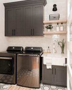 Grey And Black Laundry Room, Brown Laundry Room Cabinets, Iron Ore Cabinets Laundry Room, Dark Laundry Room Cabinets, Laundry Room Ideas Dark Appliances, Dark Small Laundry Room, Dark Cabinet Laundry Room, Graphite Laundry Room, Charcoal Washer And Dryer Laundry Rooms