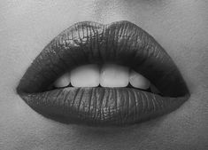 a woman's lips are shown in black and white