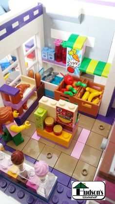 there is a toy store with lots of toys on the floor and in the kitchen