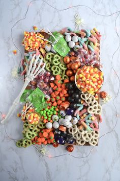 an assortment of candy and pretzels on a table