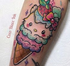 a hello kitty ice cream cone with an apple on it's head and flowers in her hair