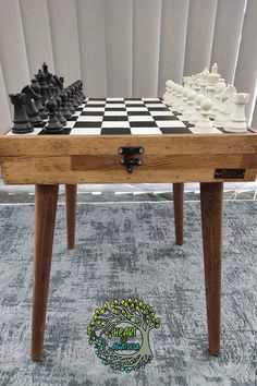 a wooden table with chess pieces on it