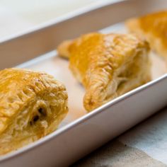 three pastries sitting on top of a white tray