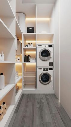 a washer and dryer in a small room with shelves on the wall behind them