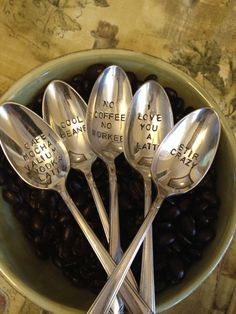 five spoons in a bowl with coffee beans and the words no coffee love you can't drink