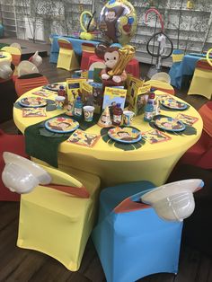 a table set up for a monkey themed birthday party