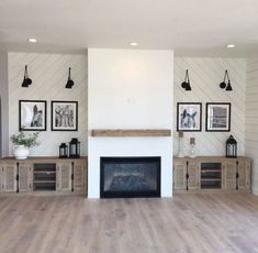 an empty living room with white walls and wood flooring on the wooden floors is shown