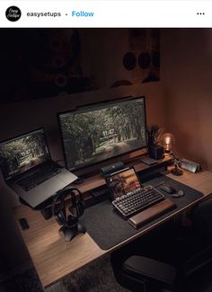 a desk with two laptops and a keyboard on it