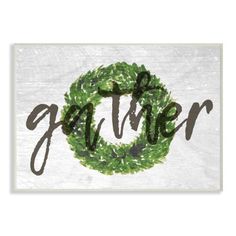 the word gather written in black and white with a green wreath