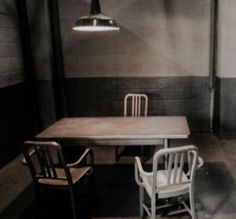 two chairs and a table in a room