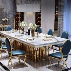 a dining room table with blue chairs and gold trimmings on the tables is surrounded by wine bottles