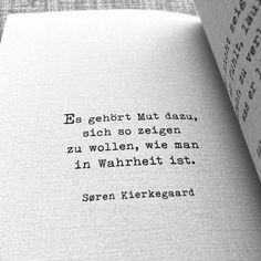 an open book with a quote on the page that reads,'es geborrtt mut dau, sicch so selgen zu wollenn, we man in wu