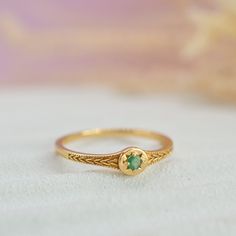 A dainty star gold ring featuring a genuine Emerald stone set in the centre of the star, perfect for bringing a dose of vibrant colour into your everyday jewellery look. Crafted from 14k gold plated on sterling silver, ensuring its durability and lustre.  Emerald: Birthstone of May. Gemstone of the goddess Venus, who's greatly admired for her feminine strength and power.  Also available in genuine blue sapphire and ruby centre stone. Blue Sapphire: https://www.etsy.com/uk/listing/1098710680/genu Dainty Gold Emerald Ring For May Birthstone, Dainty Gold Emerald Ring With Round Band, Dainty Gold Emerald Ring, Gold Dainty May Birthstone Ring, Dainty Gold May Birthstone Ring, Emerald Jewellery, Pink Jewelry Box, Star Ruby, Pink Jewelry